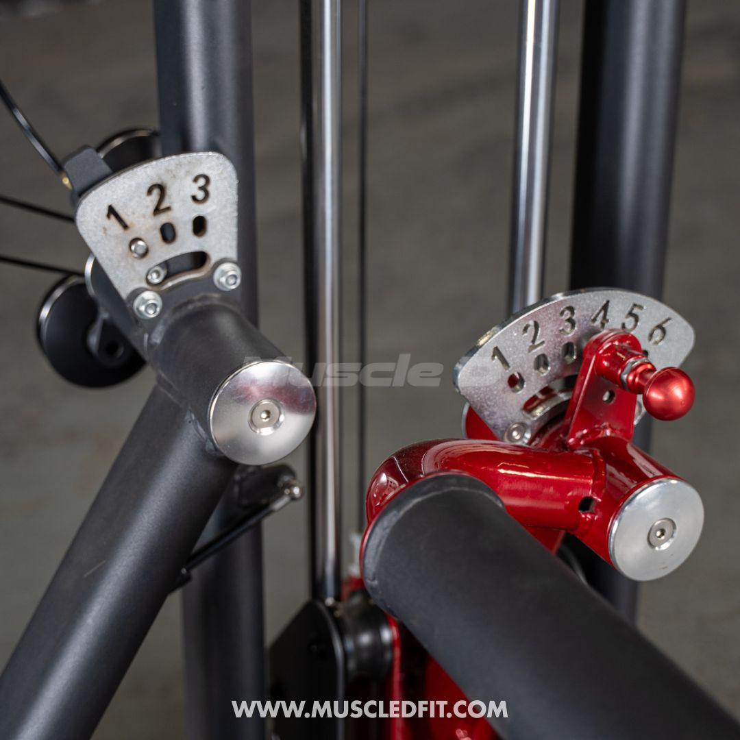 Close-up of Classic V2 Glute Kick equipment with numbered plates on a blurred background