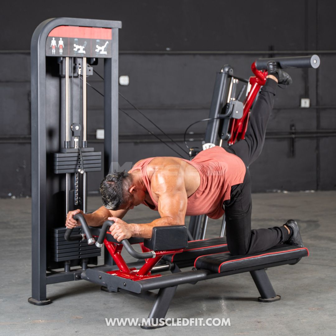 Man exercising on a Classic V2 Glute Kick - Classic V2 Glute Kick machine with a dark background