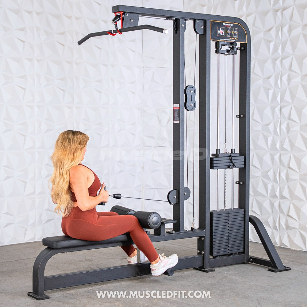 Woman using a Classic V2 Lat Pulldown / Low Row Combo machine in a gym setting with a textured white wall background.