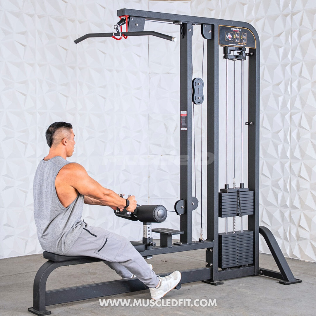 Man using a Classic-V2-Lat-Pulldown-Low-Row-Combo machine in a gym setting with a light gray wall background.