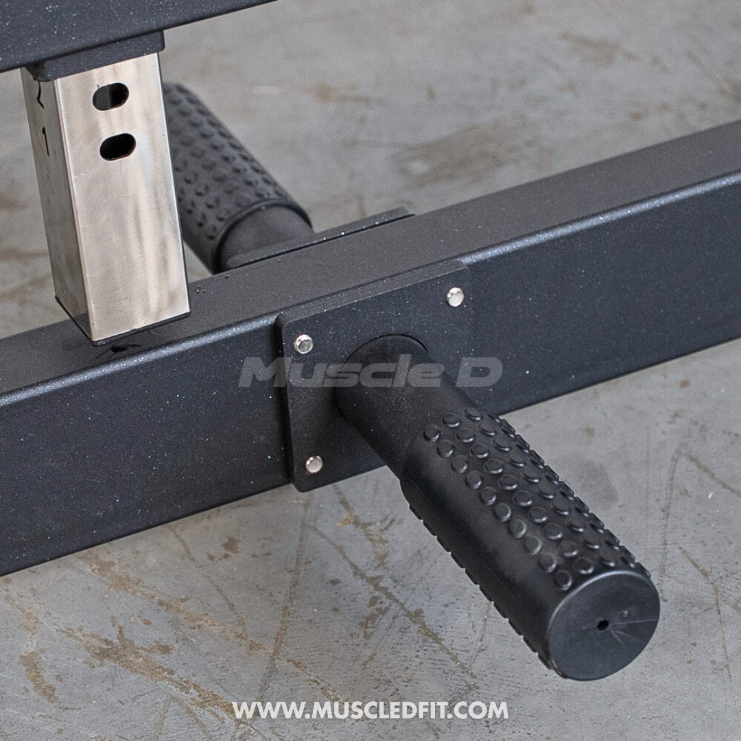 Close-up of a Classic V2 Lat Pulldown Low Row Combo foot grip with 'Muscle D' branding on a concrete floor.