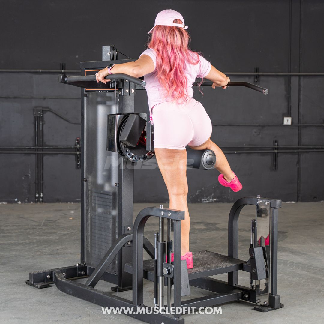 Person with pink hair using a Classic V2 Multi Hip machine in a fitness setting