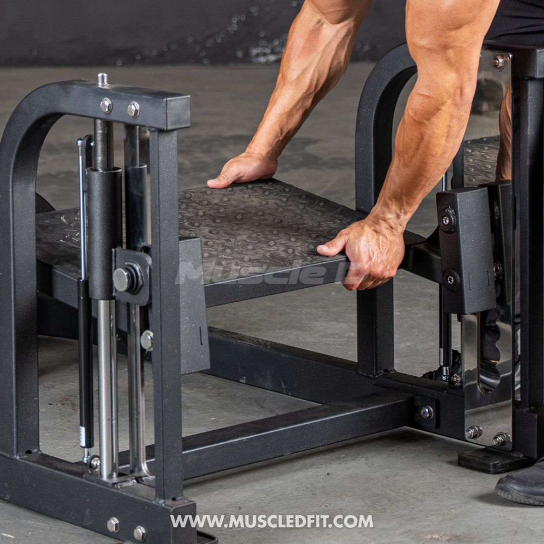 Person using a Classic V2 Multi Hip  machine in a gym setting with 'MuscleDFit' branding.