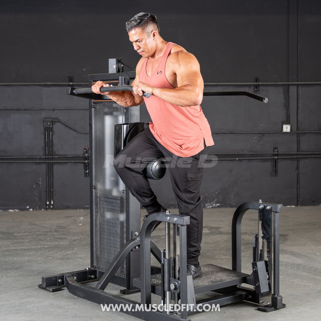 Man exercising on a Classic V2 Multi Hip  machine in a gym setting with 'Muscle D' branding.