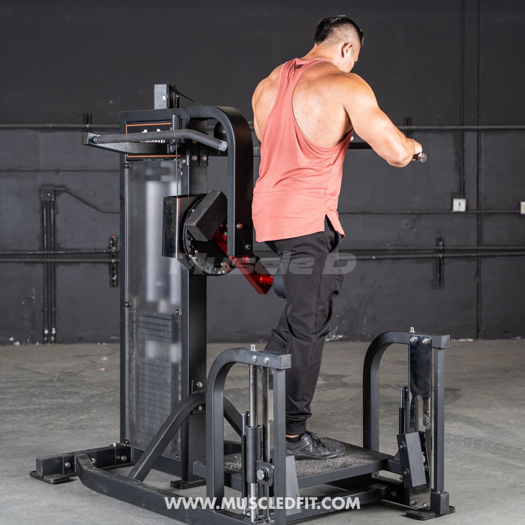 Man exercising on a Classic V2 Multi Hip  machine with a dark background