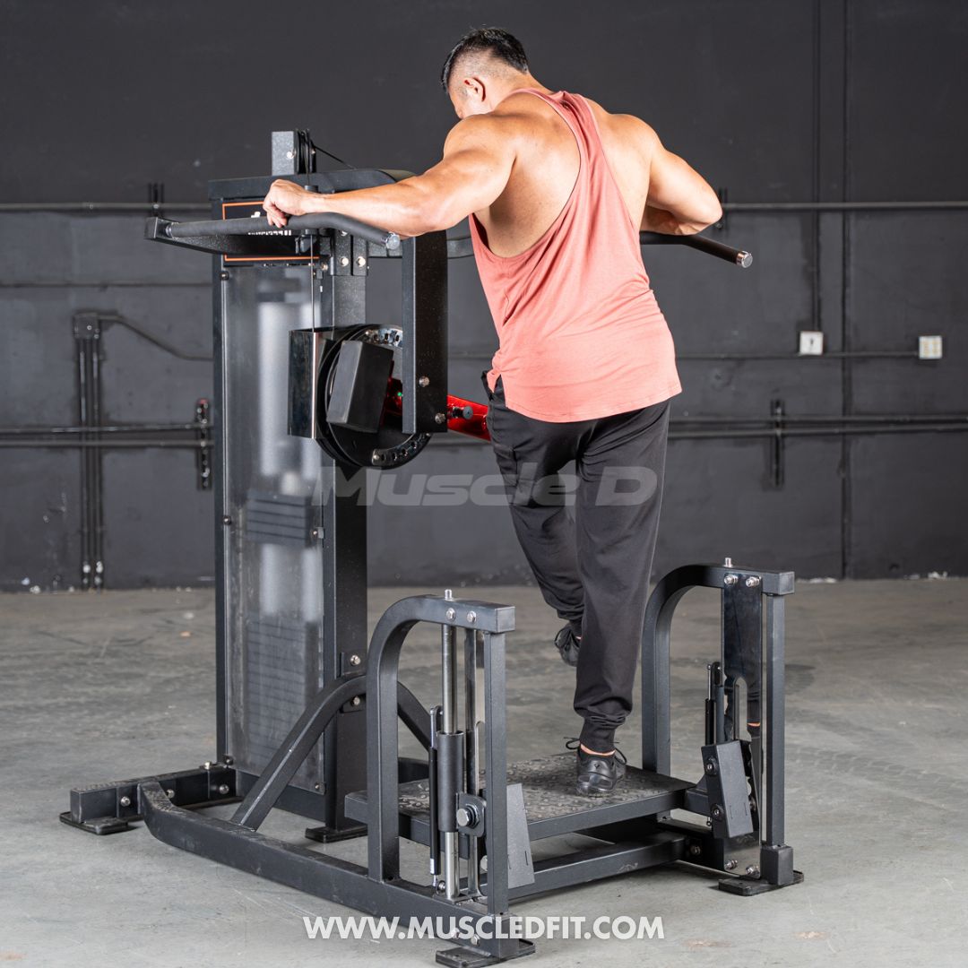Man exercising on a Classic V2 Multi Hip  machine in a gym setting with 'Muscle D' branding.