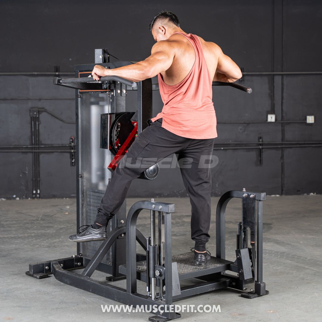 Man exercising on aClassic V2 Multi Hip machine in a gym setting with 'Muscle D' branding.