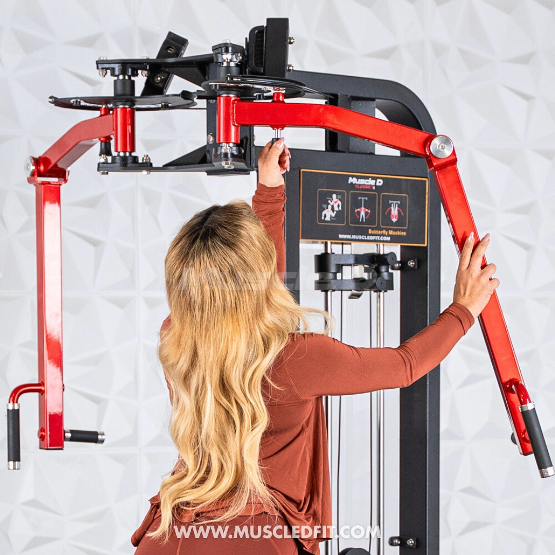 Person using a red and black Classic V2 Pec/Rear Delt Combo machine with a white background