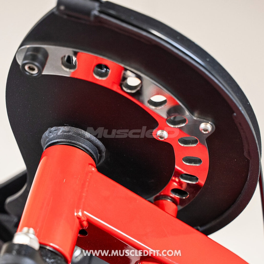 Close-up of a red and black exercise machine component of the Classic V2 Pec/Rear Delt Combo with 'Muscle' branding.