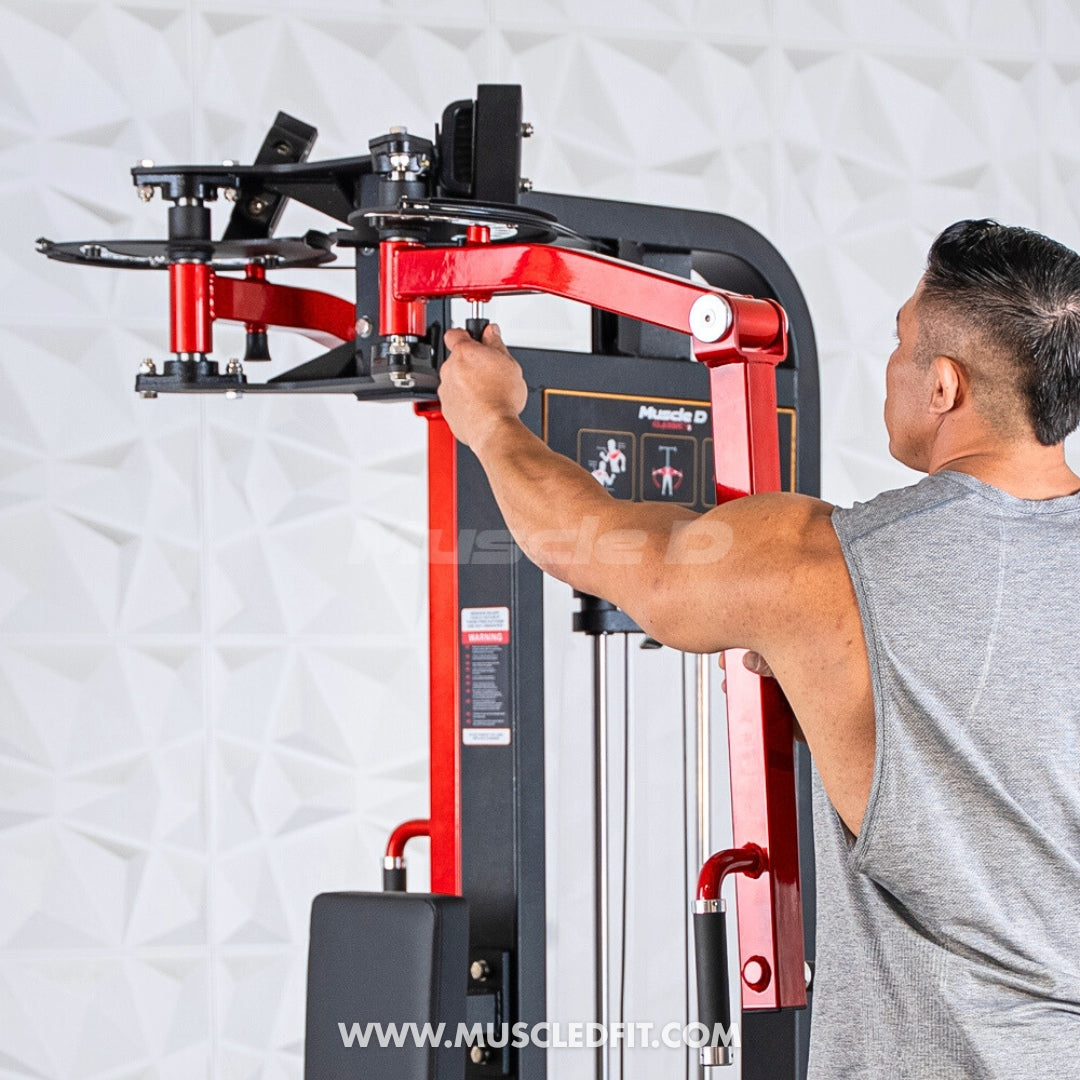 Person using a red and black Classic V2 Pec/Rear Delt Combo machine in a gym setting