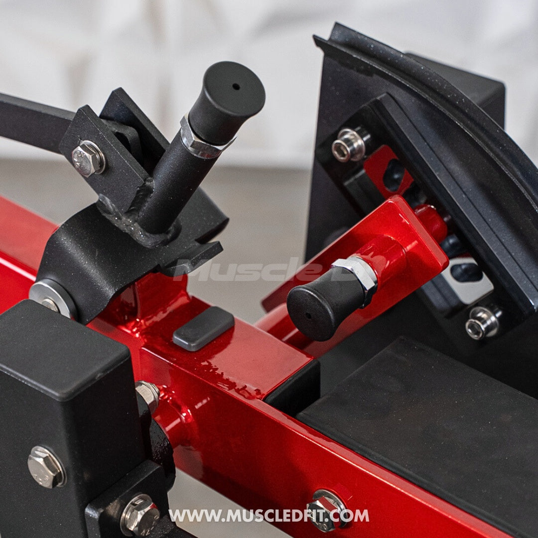 Close-up of a red and black  Classic V2 Prone Leg Curl with 'Muscle Fit' branding.