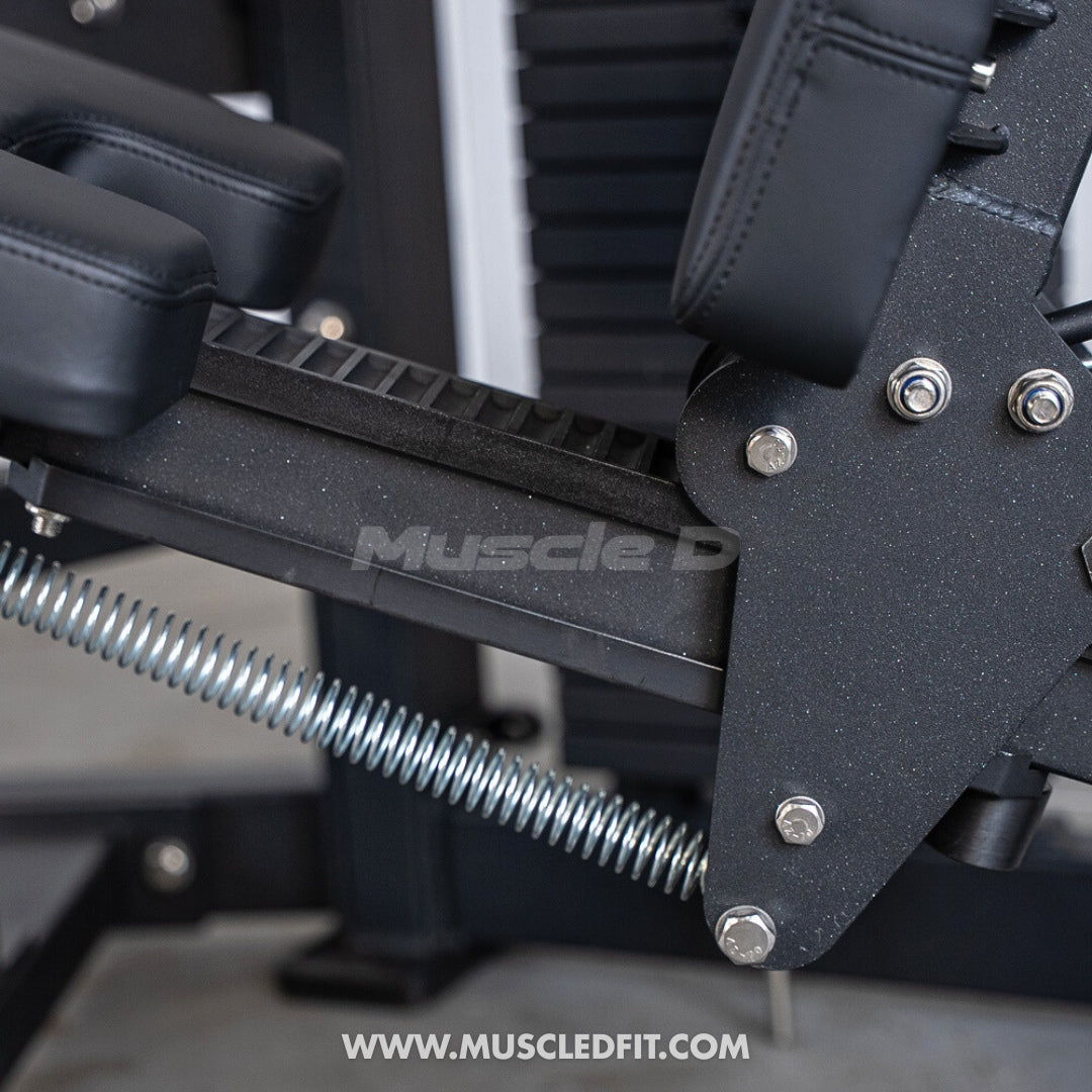 Close-up of a Classic V2 Seated Leg Curl  machine with 'Muscle D' branding and visible website URL.