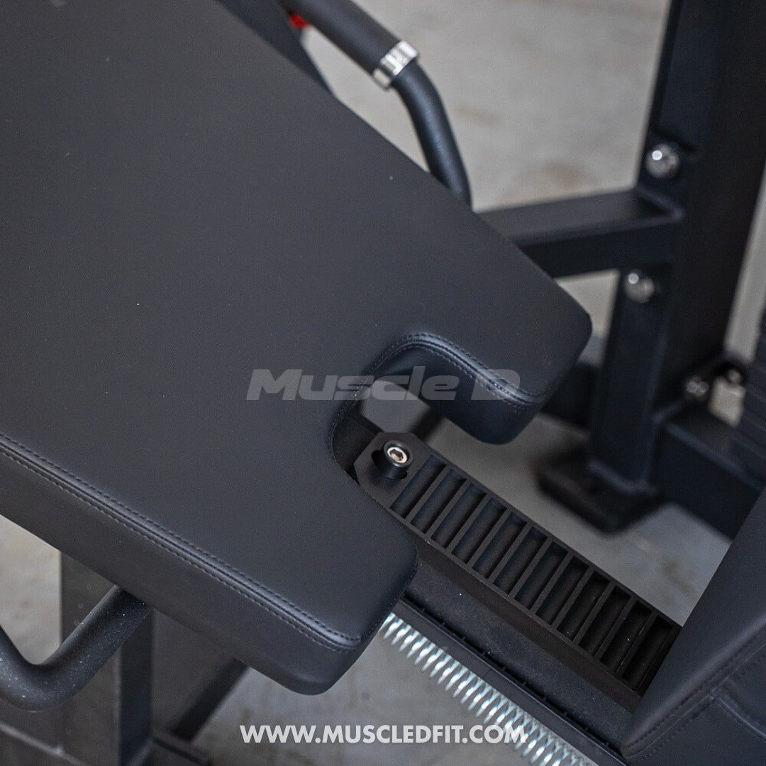 Classic V2 Seated Leg Curl with 'Muscle D' branding on a blurred background