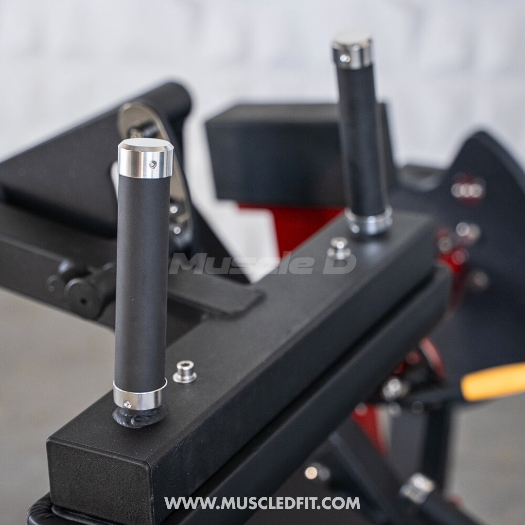 Close-up of Classic V2 Seated Leg Curl with 'Muscle D' branding on a blurred background