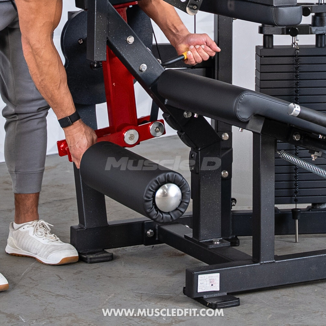 Person using a Classic V2 Seated Leg Curl machine with 'Muscle D' branding in the background.