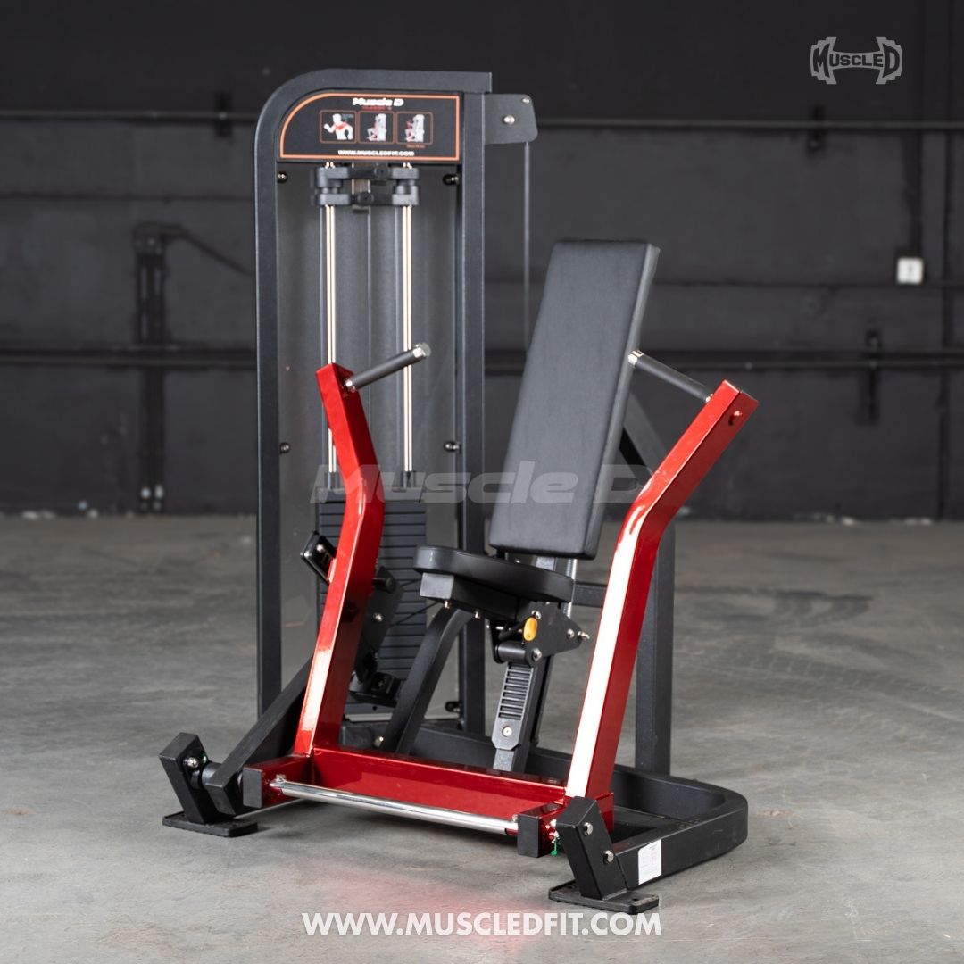 Classic V2 Selectorized Chest Press machine with red and black frame on a gray floor, brand 'Muscle D' visible