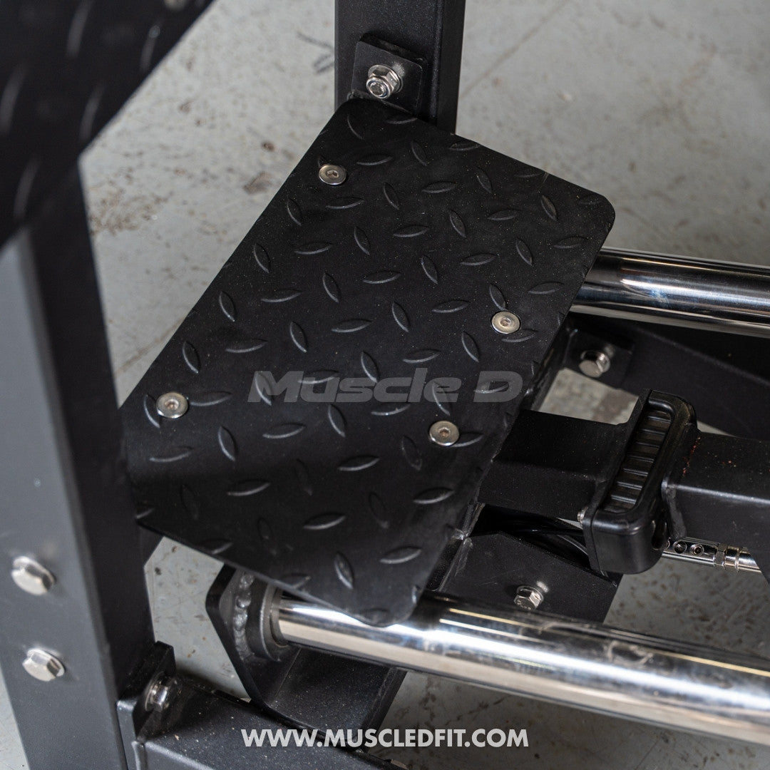 Black foot pad with textured surface attached to Classic V2 Selectorized Leg Press, featuring 'Muscle D' branding.