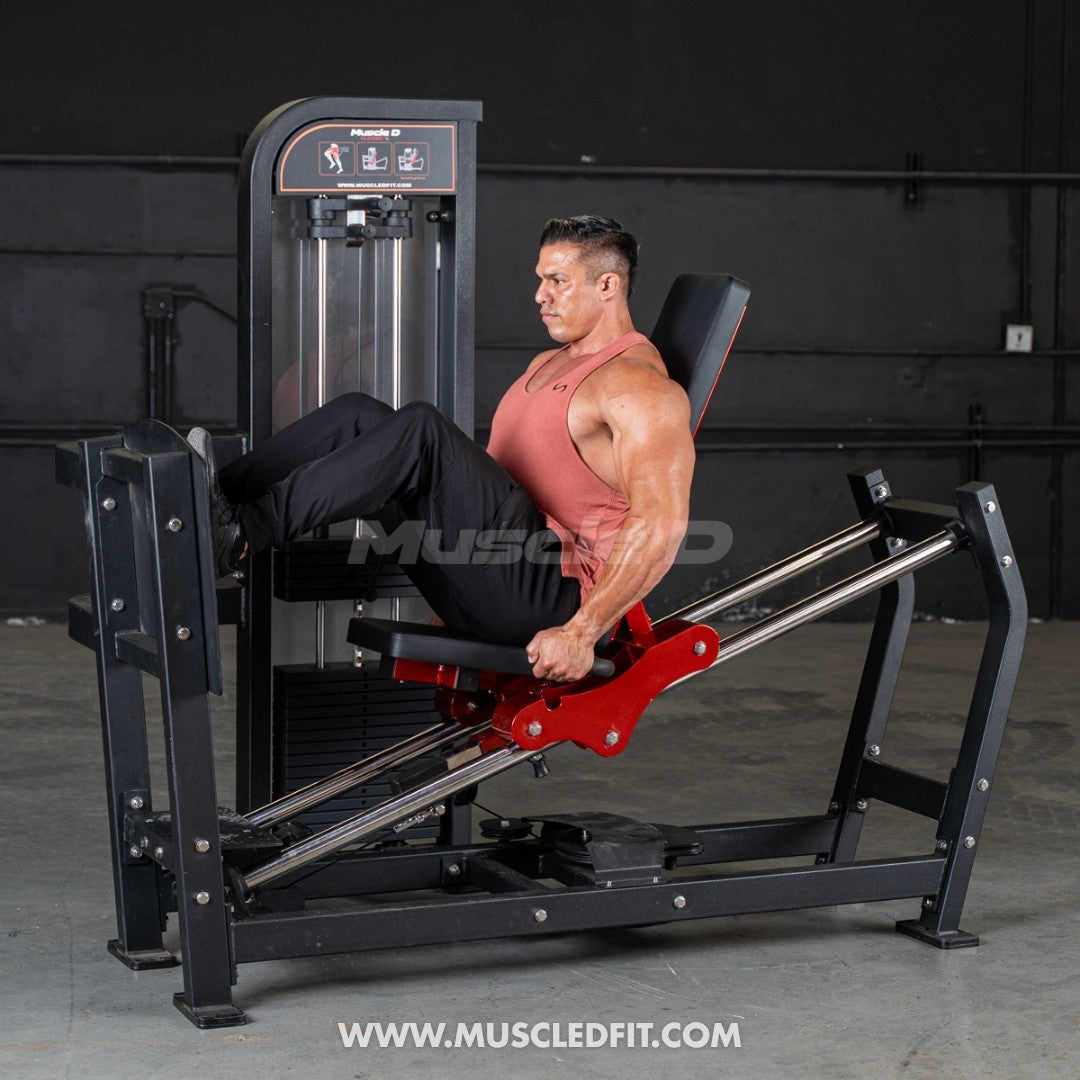 Man exercising on a Classic V2 Selectorized Leg Press  machine with 'Muscle D Fit' branding.