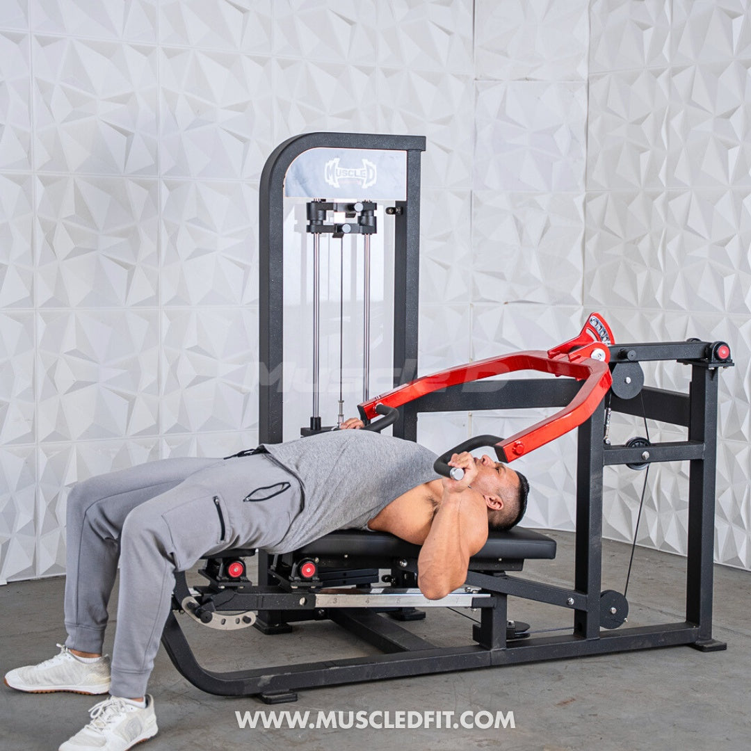 Person using a Classic-V2-Selectorized-Multi-Press-Chest_Shoulder-Press-Machine machine with a white textured wall background