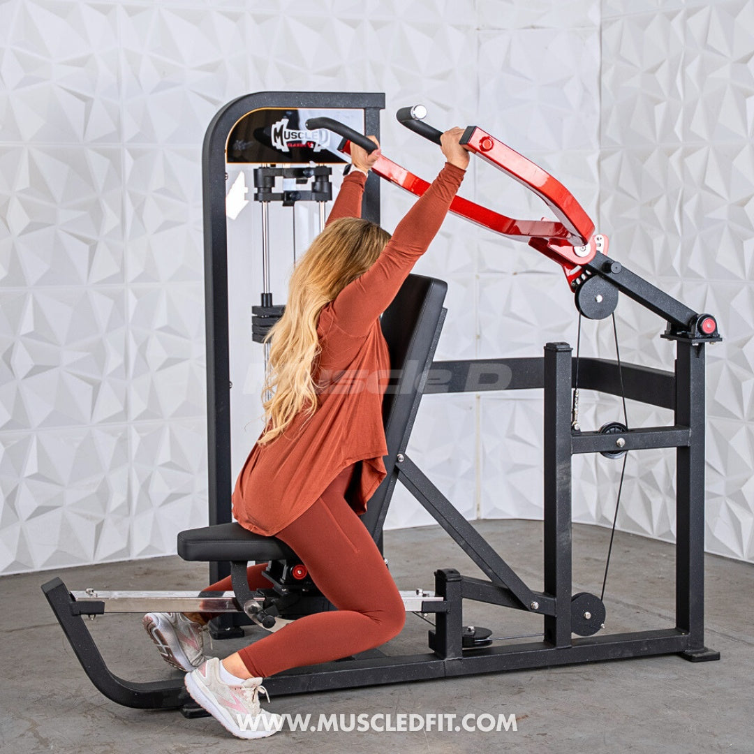 Woman exercising on a Classic V2 Selectorized Multi-Press Chest & Shoulder Press machine in a gym setting