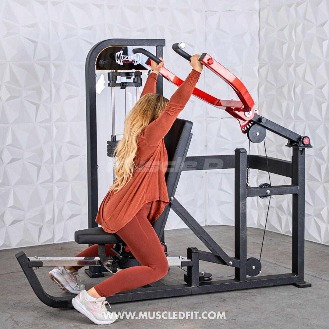 Woman exercising on a Classic V2 Selectorized Multi-Press Chest & Shoulder Press machine in a gym setting