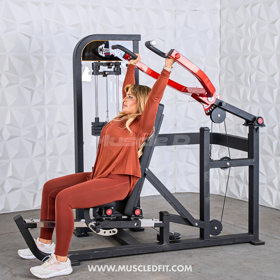 Woman exercising on a Classic V2 Selectorized Multi-Press Chest & Shoulder Press machine in a gym setting