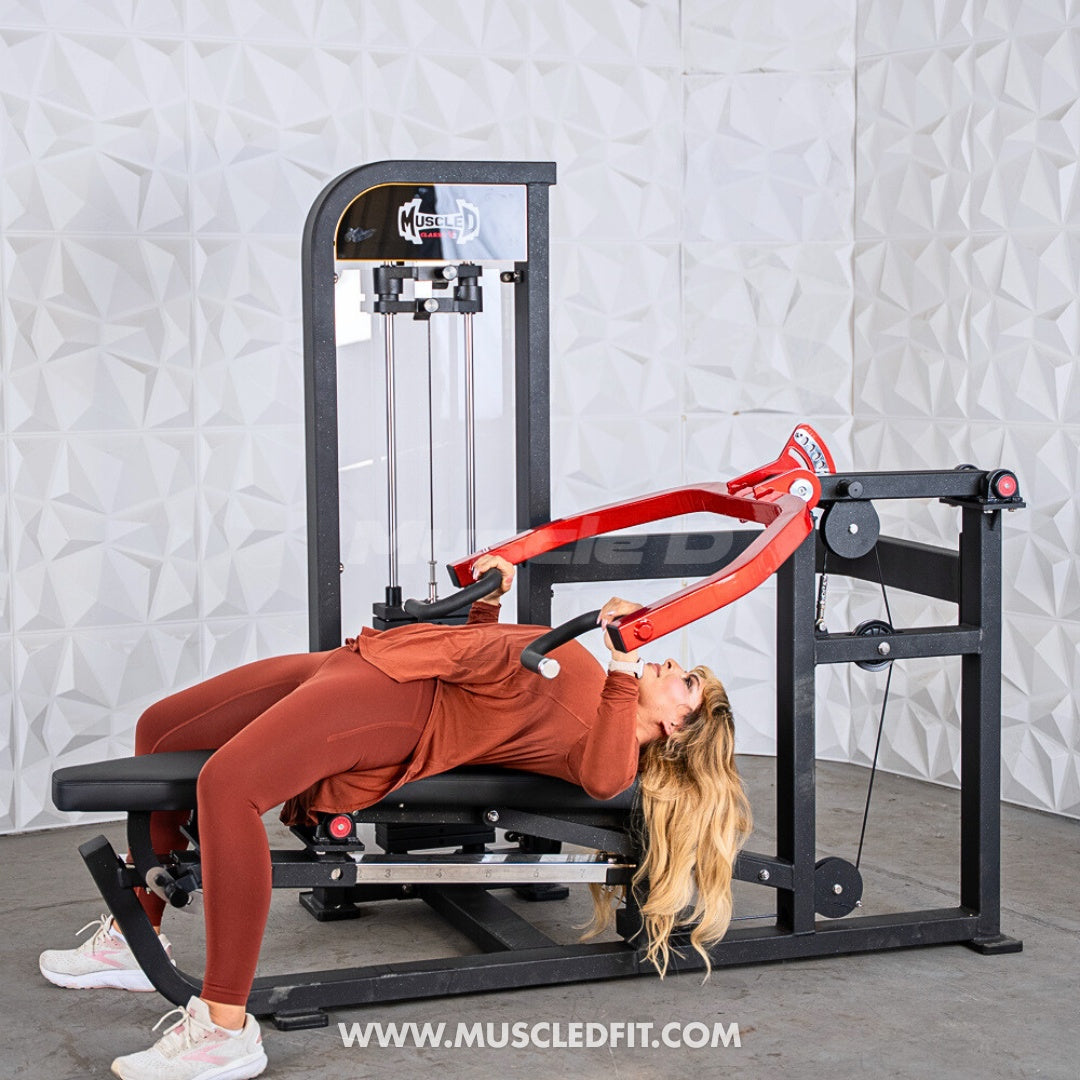 Person using a Classic V2 Selectorized Multi-Press Chest & Shoulder Press machine with 'Musclefit' branding in a gym setting.