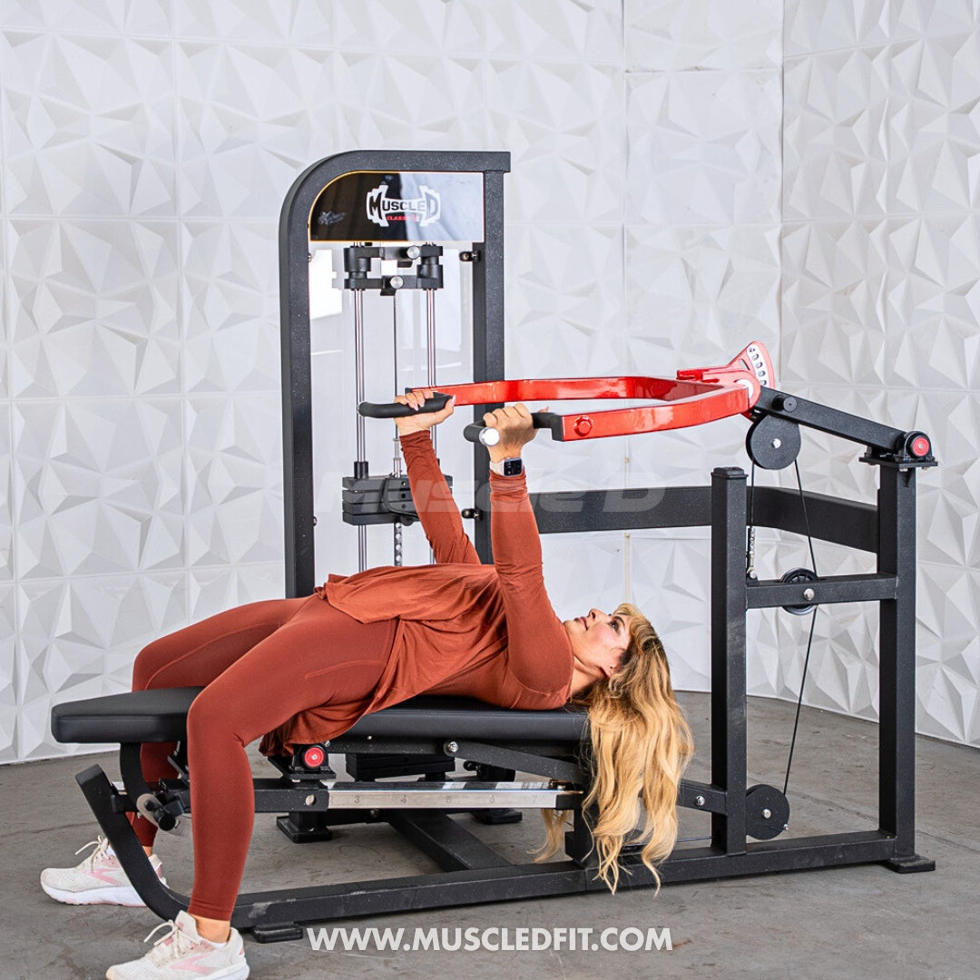 Woman exercising on a Classic V2 Selectorized Multi-Press Chest & Shoulder Press machine in a gym setting