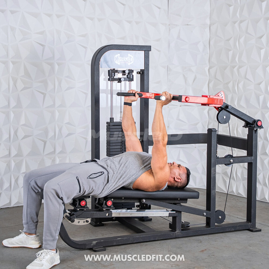 Person using a Classic V2 Selectorized Multi-Press Chest & Shoulder Press Machine for exercise with a gray wall background