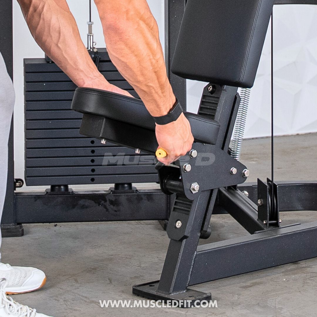 Person using a Classic V2 Shoulder Press machine in a gym setting with 'Muscle D Fit' branding.