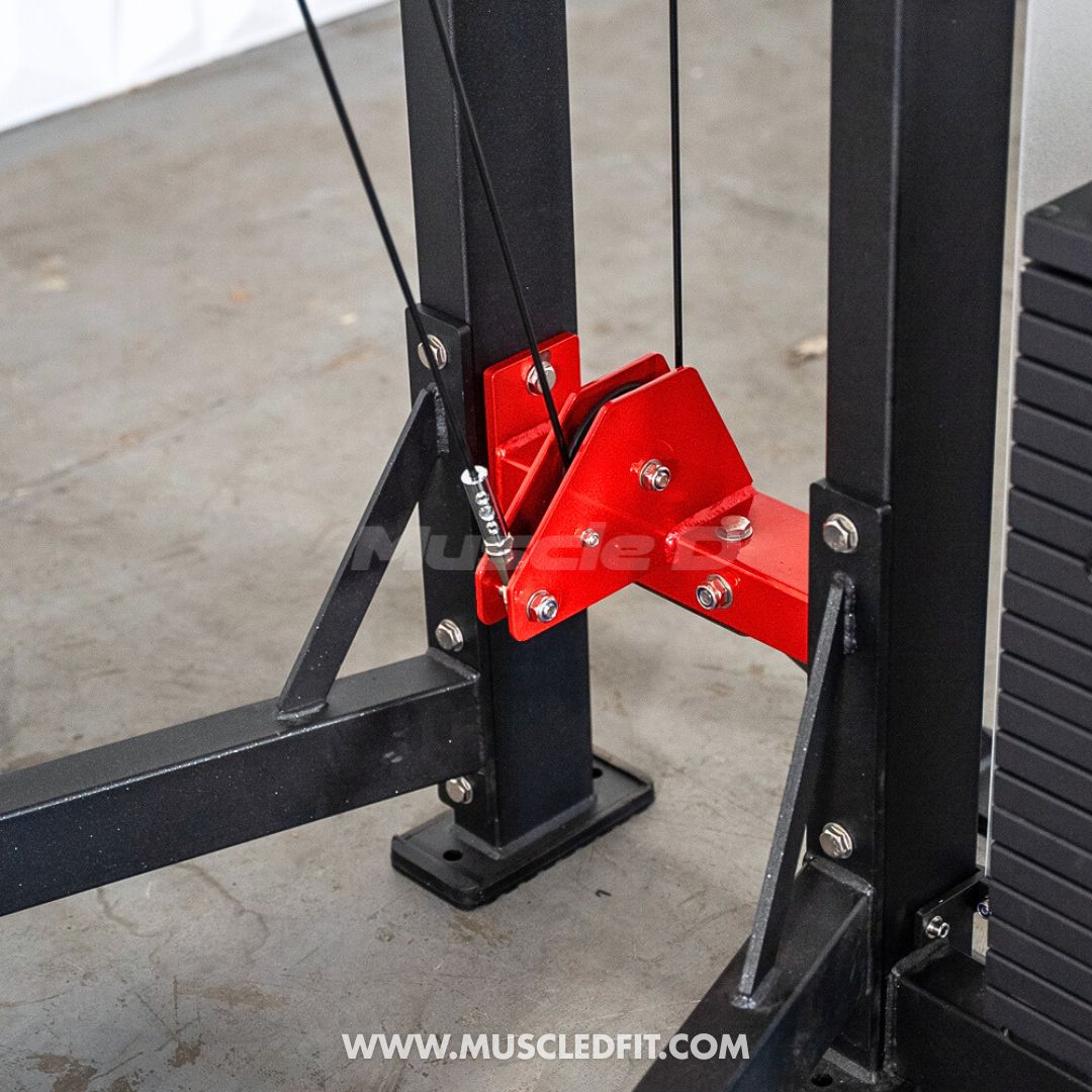 The Classic V2 Selectorized Standing Calf RaiseRed weightlifting pulley attachment on a black metal frame with a blurred background. Close up of the Classic V2 Selectorized Standing Calf Raise