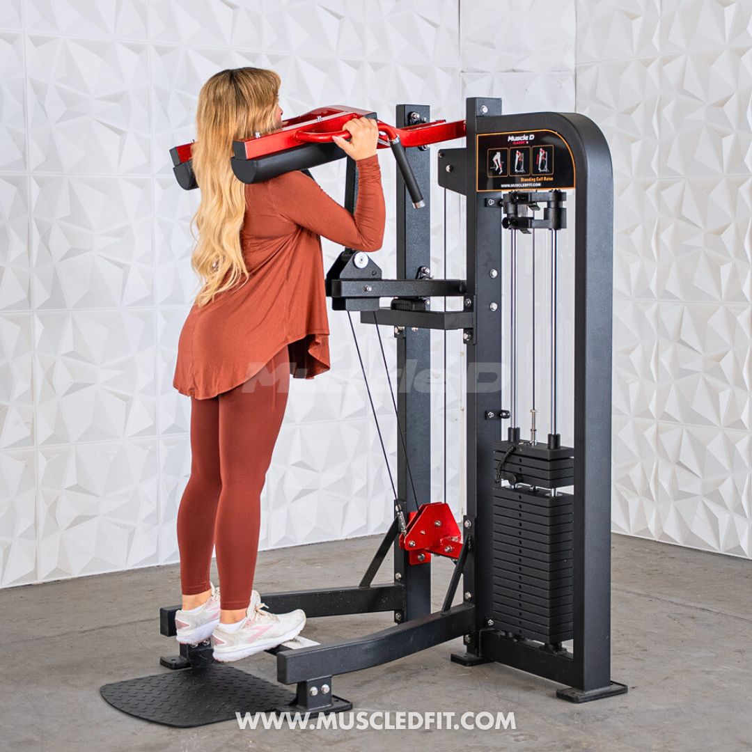 Woman exercising on a Classic V2 Selectorized Standing Calf Raise machine in a gym setting