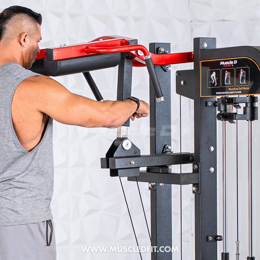 Man using a pull-up bar attachment on a Classic V2 Selectorized Standing Calf Raise machine with a white background