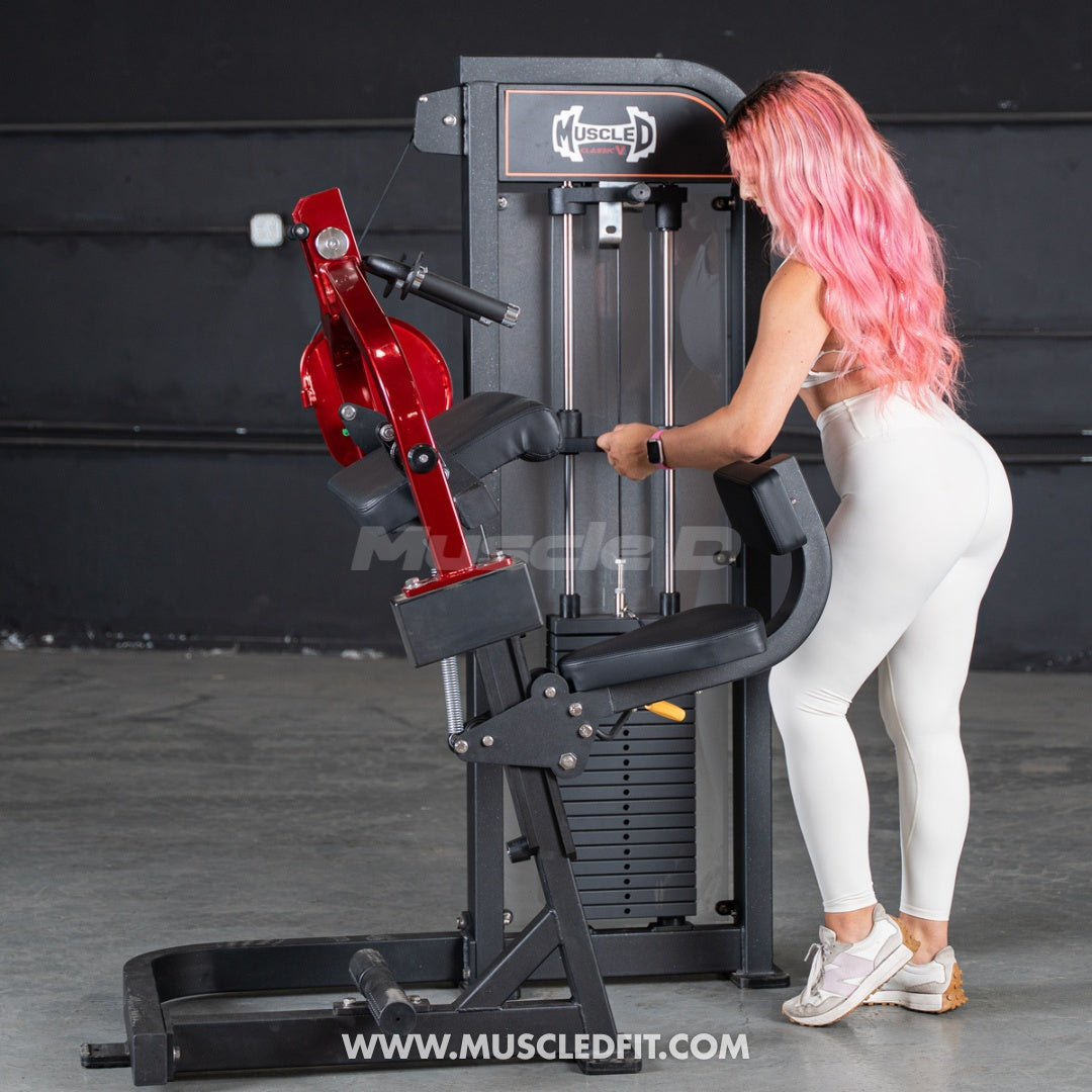 Woman exercising on a  Classic V2 Triceps extension  machine with 'Muscle D' branding in the background.