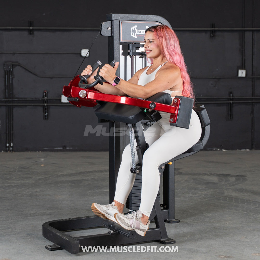 Woman exercising on a red and black  Classic V2 Triceps extension  machine with 'Muscle D Fit' branding.