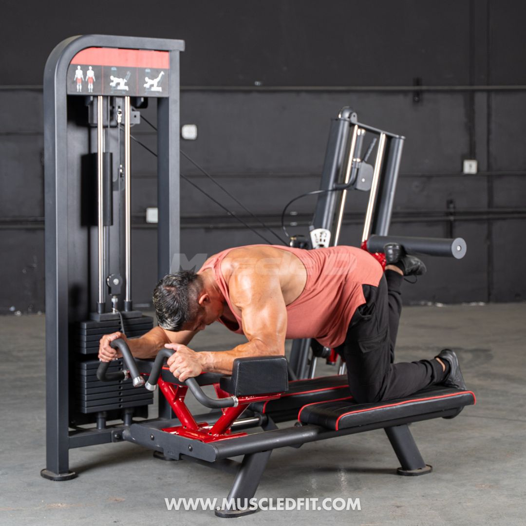 Man exercising on a Classic V2 Glute Kickmachine with 'MuscleDFit' branding.