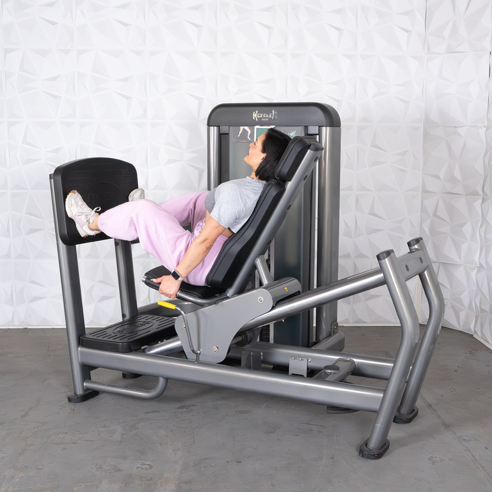 commercial black and dark grey selectorized leg press calf raise combo machine