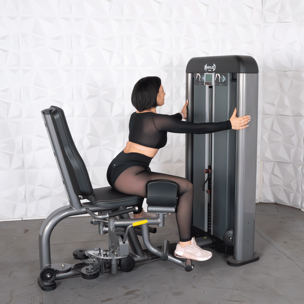 commercial black and dark grey selectorized inner outer thigh combo machine