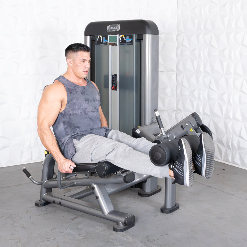 commercial black and dark grey selectorized leg extension prone leg curl combo machine