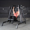 Person using an Excel Flat, Incline, Decline Convergent Smith Machine bench in a gym setting.