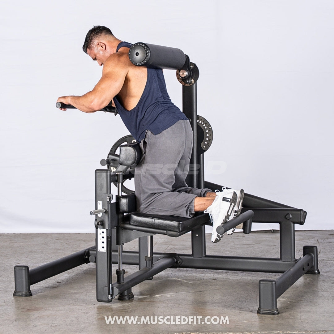 Man using an Excel Kneeling Glute Hip Extension machine with a plain background