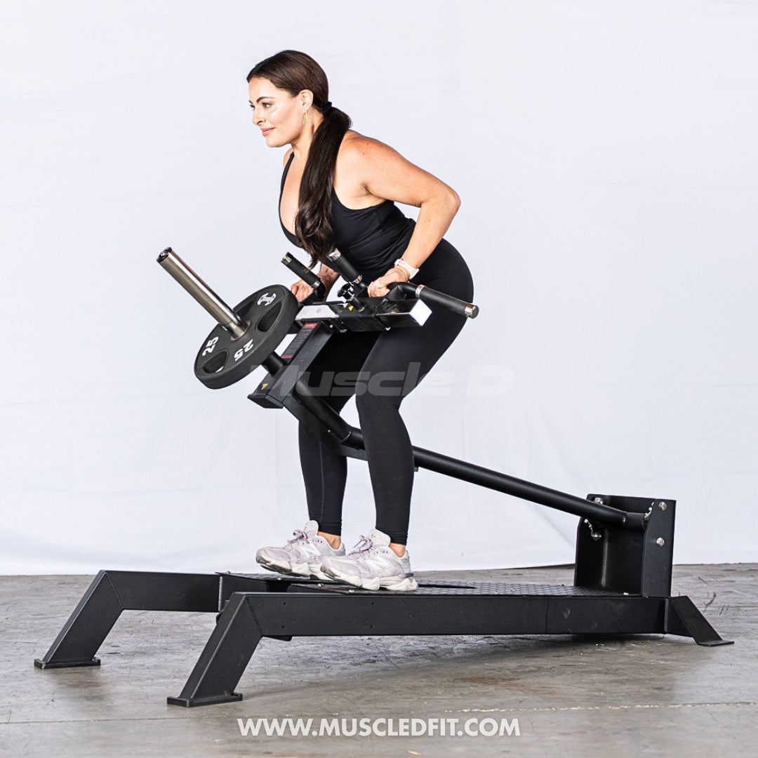 Woman exercising on an Excel Multi-Grip T-Bar Row machine with a white background