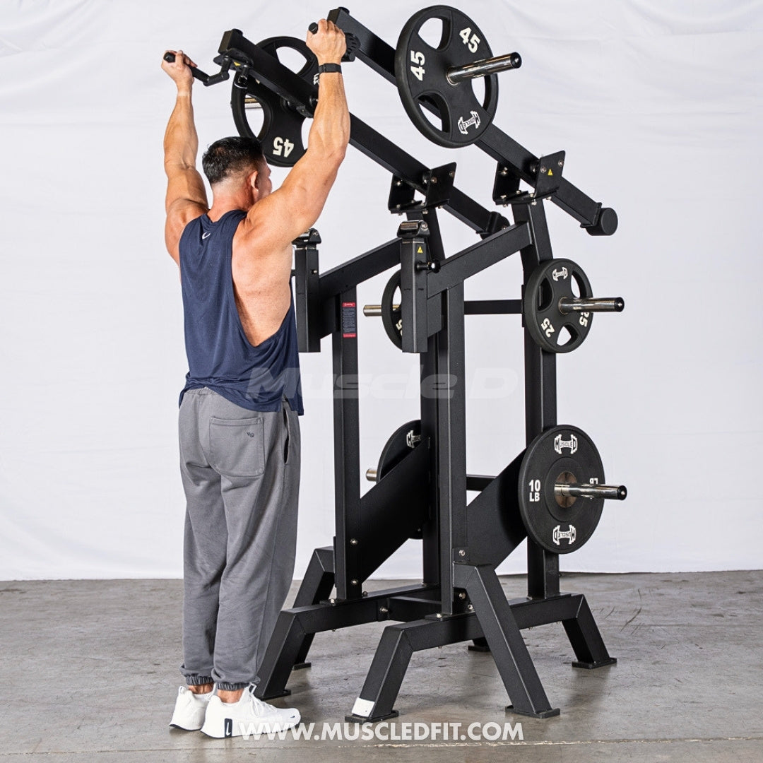 Person using an Excel Viking Press machine in a gym setting with a white background
