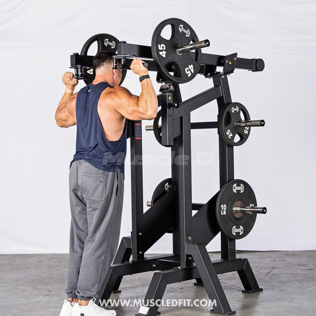 Man using an Excel Viking Press machine in a gym setting with a white background