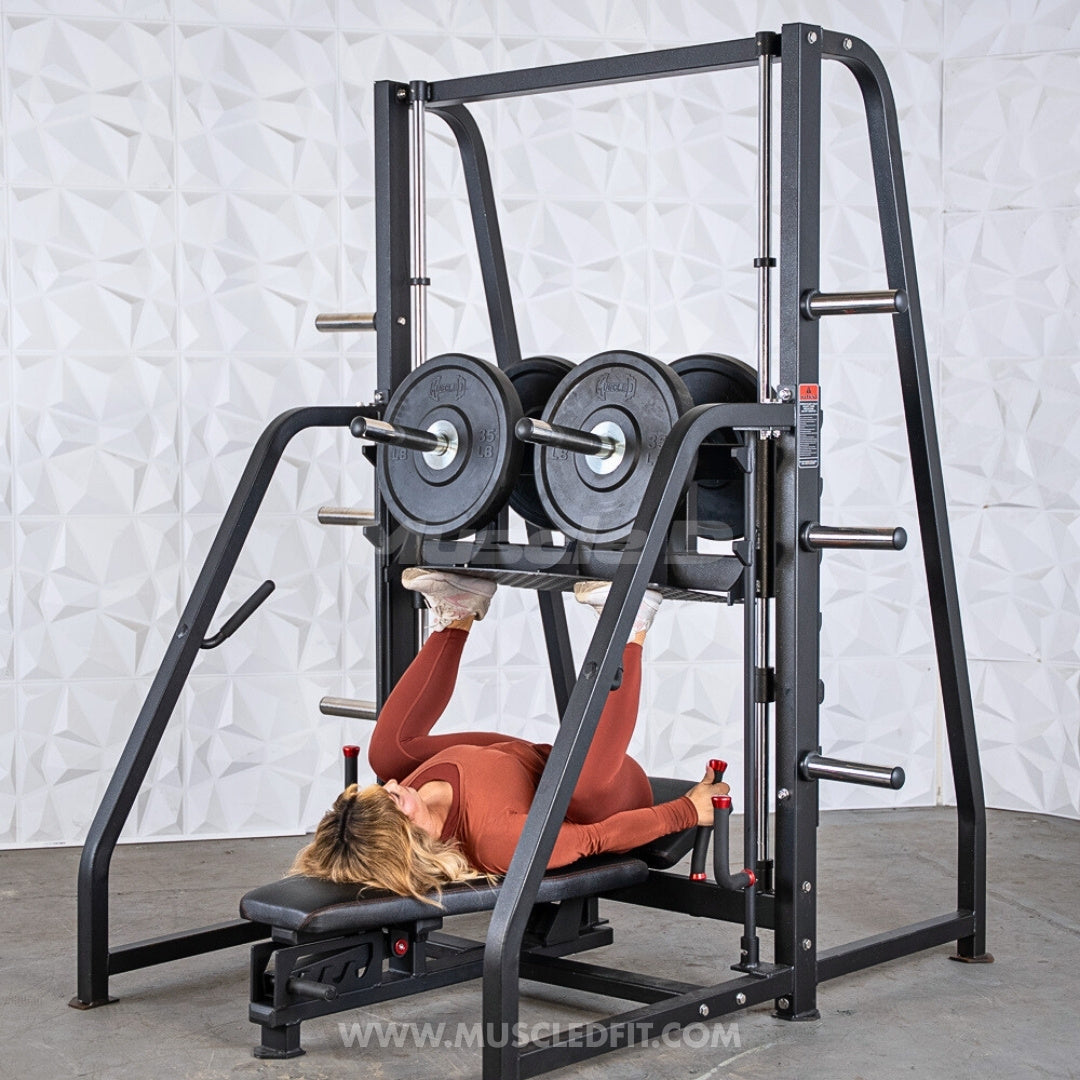 Person using an Excel Vertical Leg Press in a gym setting with a white textured wall background.