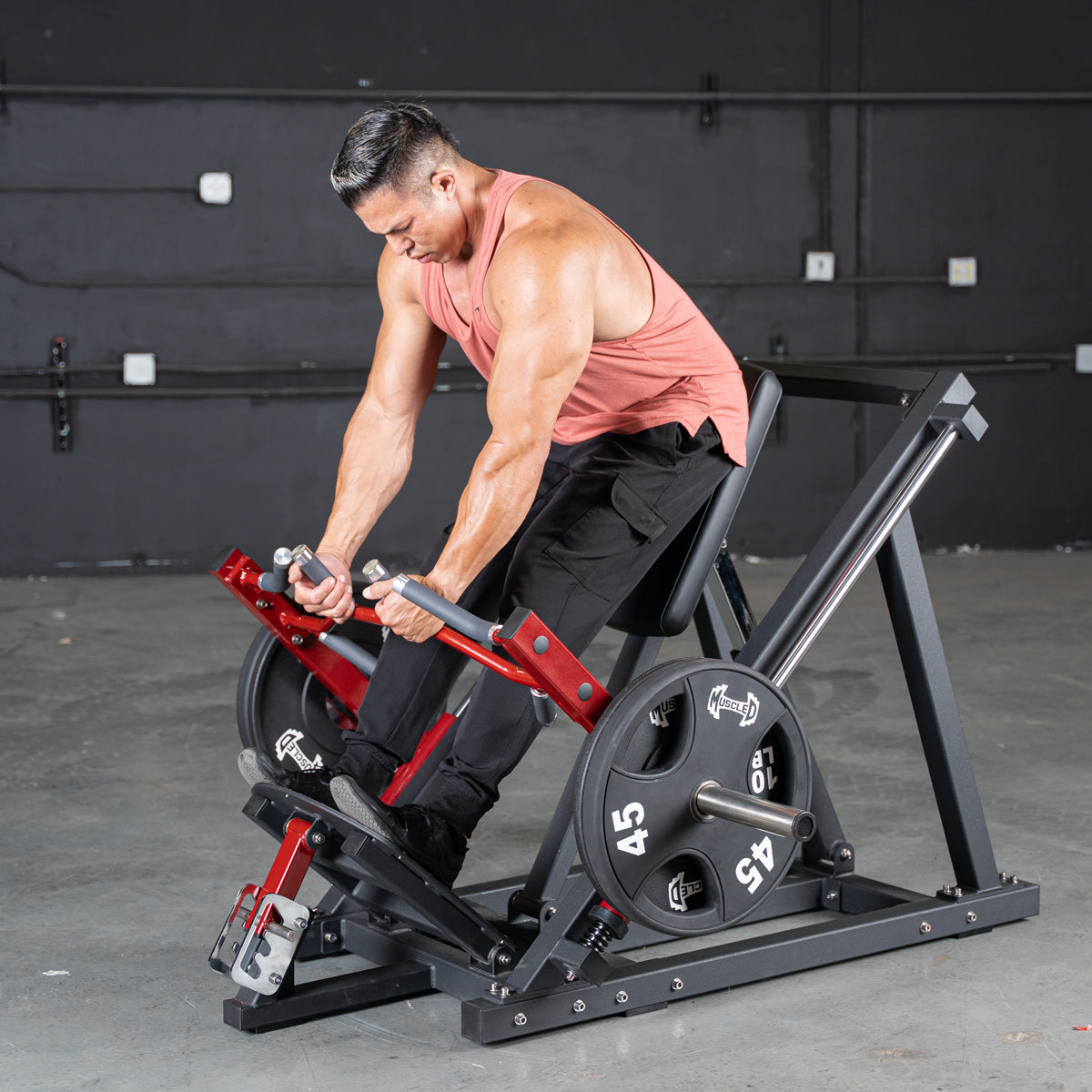 Man exercising on a Power Leverage V2 Linear Bearing Row machine with weights in a gym setting by Muscle D Fitness