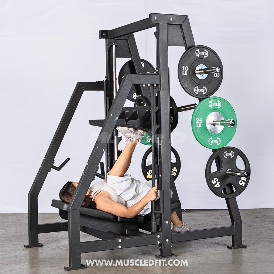 Person using a Pro Strength Vertical Leg Press machine with green and black weights on a gray floor.