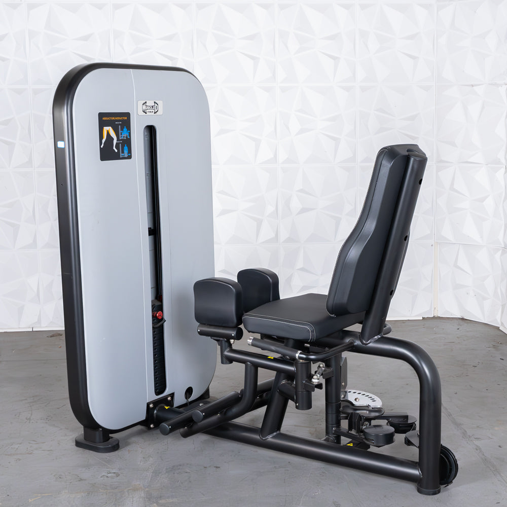 commercial grade black and white selectorized inner outer thigh combo machine