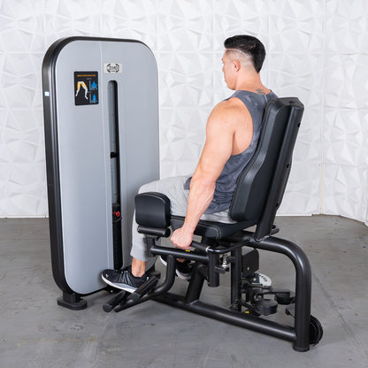 commercial grade black and white selectorized inner outer thigh combo machine