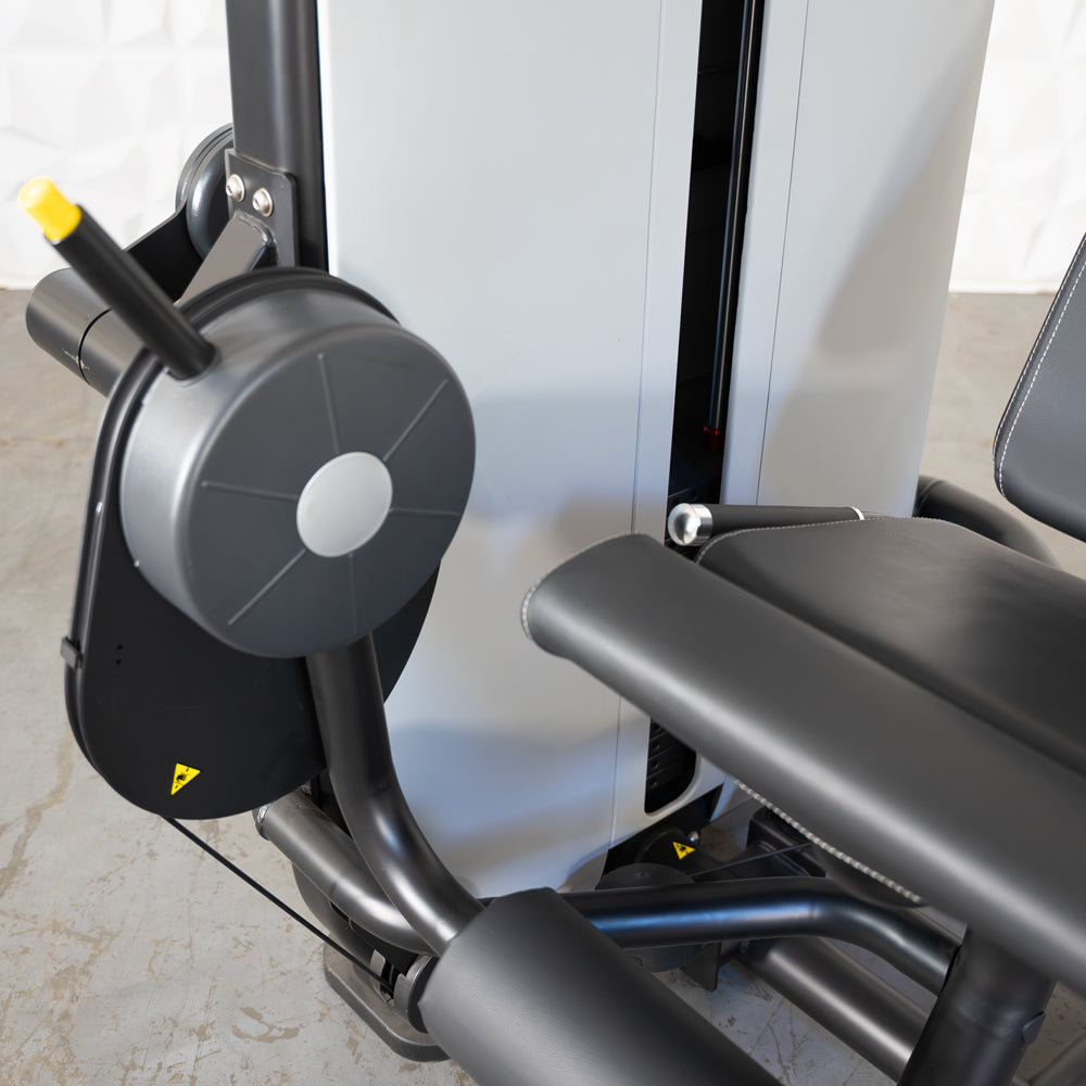 commercial grade black and white selectorized leg extension machine detail